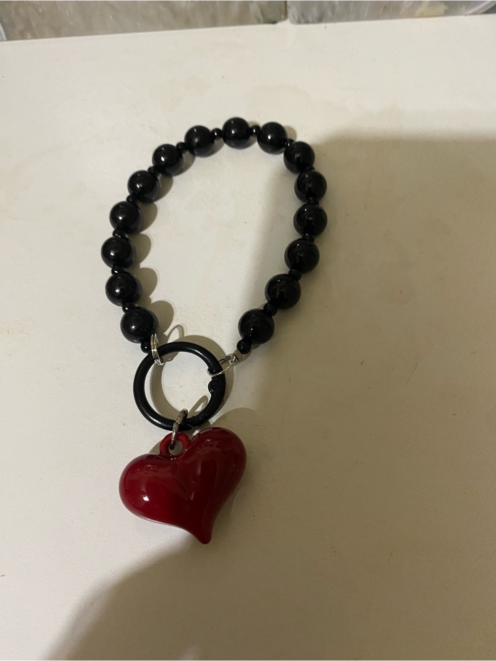 Black Beaded Bracelet with Red Heart Pendant